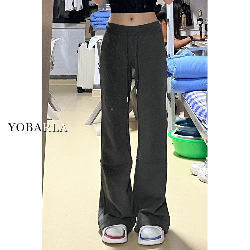 Women's black flared casual pants, autumn and winter style, fleece-lined, thickened, stretchy, plus size, flattering for pear-shaped figures, sporty sweatpants.