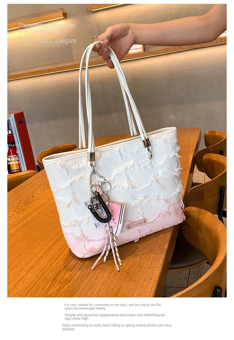 New niche tote bag for women, large capacity, suitable for commuting, handbag, shoulder bag, or underarm bag.