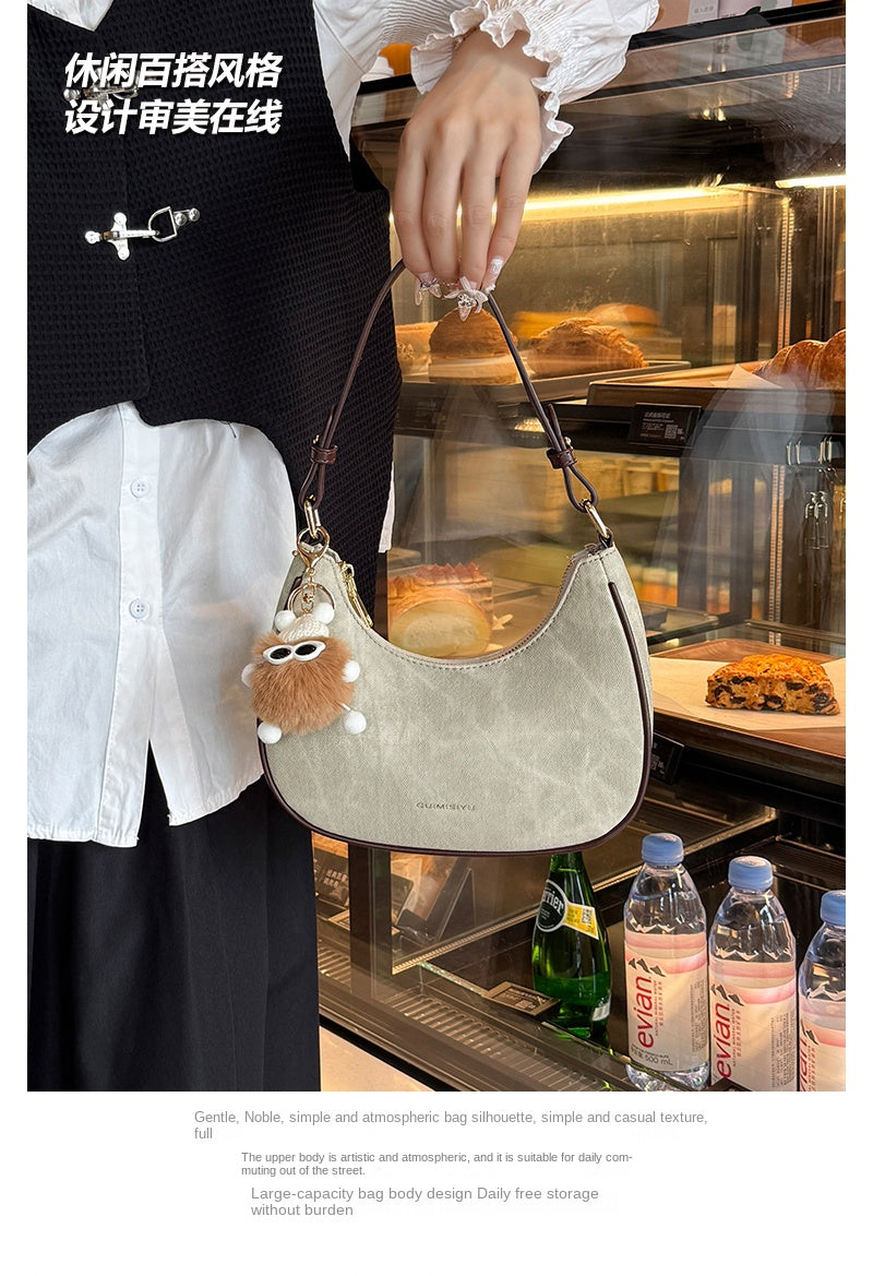 New women's baguette bag, sophisticated and trendy, suitable for underarms, shoulder bag, or handbag; crescent-shaped bag.
