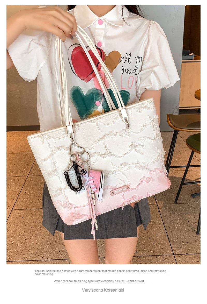 New niche tote bag for women, large capacity, suitable for commuting, handbag, shoulder bag, or underarm bag.