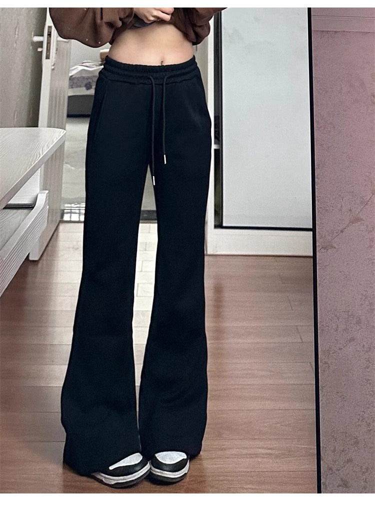 Women's black flared casual pants, autumn and winter style, fleece-lined, thickened, stretchy, plus size, flattering for pear-shaped figures, sporty sweatpants.