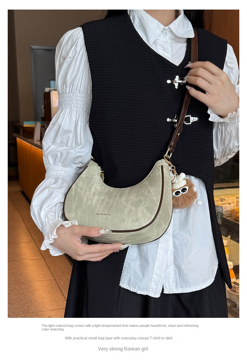 New women's baguette bag, sophisticated and trendy, suitable for underarms, shoulder bag, or handbag; crescent-shaped bag.