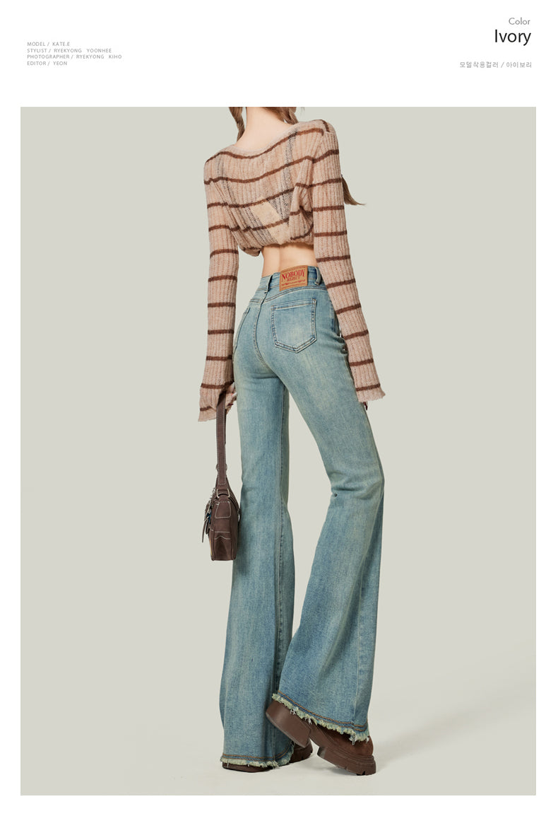 Light blue flared jeans for women, high-waisted, slim-fitting, platform style, floor-length.
