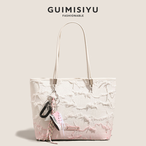 New niche tote bag for women, large capacity, suitable for commuting, handbag, shoulder bag, or underarm bag.