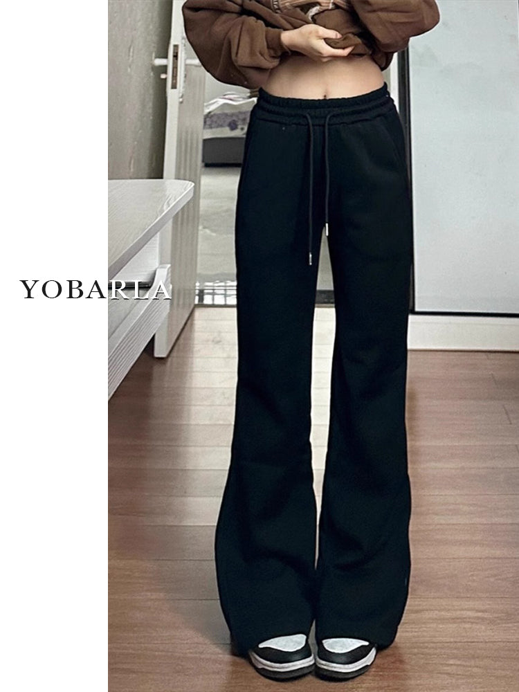 Women's black flared casual pants, autumn and winter style, fleece-lined, thickened, stretchy, plus size, flattering for pear-shaped figures, sporty sweatpants.