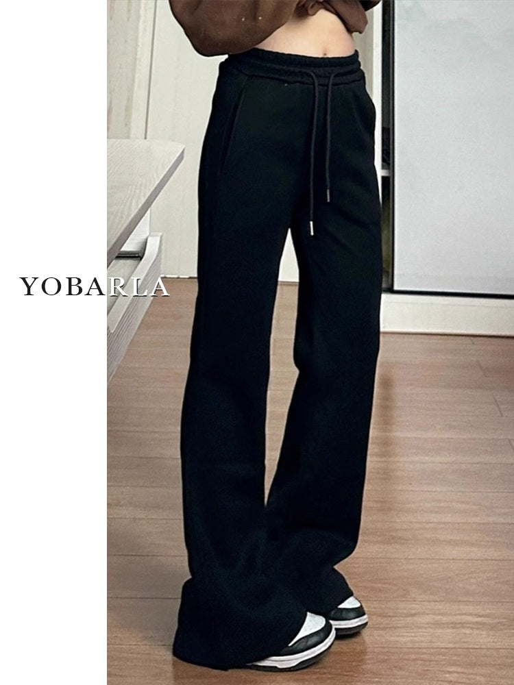 Women's black flared casual pants, autumn and winter style, fleece-lined, thickened, stretchy, plus size, flattering for pear-shaped figures, sporty sweatpants.